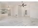 Spacious living room featuring a ceiling fan, marble floors, and a front door at 2520 Springridge Dr, Las Vegas, NV 89134