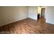 Bedroom featuring wood-look flooring, neutral paint, and access to ensuite bathroom at 2606 S Durango Dr # 172, Las Vegas, NV 89117