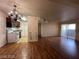 Living room featuring wood floors, sliding glass doors, and open access to the kitchen at 2606 S Durango Dr # 172, Las Vegas, NV 89117