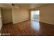 Living room featuring wood floors and sliding glass doors for natural light at 2606 S Durango Dr # 172, Las Vegas, NV 89117