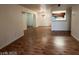 Open concept living room and dining room space with wood-look floors and neutral paint at 2606 S Durango Dr # 172, Las Vegas, NV 89117