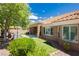 Cozy backyard featuring artificial turf, a hot tub, and covered patio area at 2705 Tumble Brook Dr, Las Vegas, NV 89134