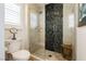 Modern bathroom featuring glass enclosed shower with modern tilework and a comfortable toilet with fixtures at 2705 Tumble Brook Dr, Las Vegas, NV 89134