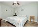 Inviting bedroom with a plush bed, soft color palette, and a ceiling fan for a relaxing and cozy atmosphere at 2705 Tumble Brook Dr, Las Vegas, NV 89134