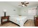 Comfortable bedroom featuring a ceiling fan, natural light from the windows, and coastal-themed decor at 2705 Tumble Brook Dr, Las Vegas, NV 89134