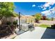 Relaxing backyard hot tub under umbrella with patio and landscaped surroundings at 2705 Tumble Brook Dr, Las Vegas, NV 89134