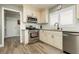 Updated kitchen with granite countertops, stainless steel appliances, and ample cabinet space at 2705 Tumble Brook Dr, Las Vegas, NV 89134