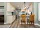 Bright kitchen showcasing stainless steel appliances, a breakfast bar, and ample counter space at 2705 Tumble Brook Dr, Las Vegas, NV 89134