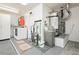 Practical laundry area with essential appliances, storage, and a utility sink for added convenience at 2705 Tumble Brook Dr, Las Vegas, NV 89134