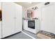 Functional laundry room with modern appliances, ample storage, and a clean, organized space at 2705 Tumble Brook Dr, Las Vegas, NV 89134