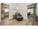 Inviting living room area featuring tiled flooring with views of the adjacent kitchen and dining area at 2705 Tumble Brook Dr, Las Vegas, NV 89134
