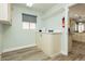 Well-organized room with storage cabinets, a window, and easy access to the kitchen, offering practicality at 2705 Tumble Brook Dr, Las Vegas, NV 89134