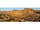Expansive aerial view of a desert community set against a backdrop of majestic mountains under a clear sky at 2742 Darby Falls Dr, Las Vegas, NV 89134