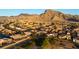 Wide shot showcasing a residential neighborhood near a well-maintained golf course with mountain views at 2742 Darby Falls Dr, Las Vegas, NV 89134