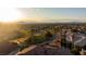 Breathtaking view of a city skyline from a golf community neighborhood during a sunset at 2742 Darby Falls Dr, Las Vegas, NV 89134