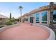 Back of home has covered patio, rock landscaping, and several large windows at 2742 Darby Falls Dr, Las Vegas, NV 89134