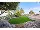 Backyard area featuring rock landscaping and artificial grass at 2742 Darby Falls Dr, Las Vegas, NV 89134