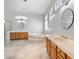 Primary bath featuring double vanity, soaking tub, tile flooring, and framed mirrors at 2742 Darby Falls Dr, Las Vegas, NV 89134
