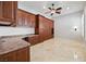 Bedroom features built in cabinets, desk and murphy bed with a modern ceiling fan at 2742 Darby Falls Dr, Las Vegas, NV 89134