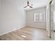 Bright bedroom with neutral walls, ceiling fan, a window, and plank floors at 2742 Darby Falls Dr, Las Vegas, NV 89134