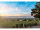 Stunning city views from a hilltop property showcasing landscaping and distant mountains at 2742 Darby Falls Dr, Las Vegas, NV 89134