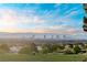 Panoramic city view featuring iconic landmarks, lush greenery, and a stunning sky at 2742 Darby Falls Dr, Las Vegas, NV 89134