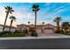 Charming single-story home featuring a three-car garage, mature landscaping, and tile roofing at 2742 Darby Falls Dr, Las Vegas, NV 89134