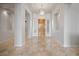 Grand foyer boasts tile floors, tray ceilings, and a decorative chandelier at 2742 Darby Falls Dr, Las Vegas, NV 89134