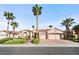 Beautiful home exterior with large driveway and palm trees at 2742 Darby Falls Dr, Las Vegas, NV 89134