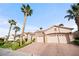Exterior view with desert landscaping and palm trees at 2742 Darby Falls Dr, Las Vegas, NV 89134