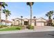 Charming home exterior with lush lawn and desert landscaping at 2742 Darby Falls Dr, Las Vegas, NV 89134
