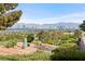 Golf course view with desert landscaping and Las Vegas skyline at 2742 Darby Falls Dr, Las Vegas, NV 89134