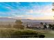 Golf course view showcasing city skyline, mature trees, and lush landscaping at 2742 Darby Falls Dr, Las Vegas, NV 89134