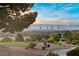 Scenic golf course with city views, lush green landscape, and clear skies at 2742 Darby Falls Dr, Las Vegas, NV 89134