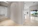 Bright hallway leading to a kitchen and outdoor patio at 2742 Darby Falls Dr, Las Vegas, NV 89134
