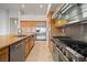 Fully-equipped kitchen with stainless appliances, ample countertops, and custom wood cabinets at 2742 Darby Falls Dr, Las Vegas, NV 89134