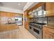 Well-equipped kitchen with stainless steel appliances, custom cabinets, and ample countertop space at 2742 Darby Falls Dr, Las Vegas, NV 89134