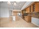 Open-concept kitchen features a large island, stainless steel appliances, and custom wood cabinetry at 2742 Darby Falls Dr, Las Vegas, NV 89134