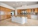 Spacious kitchen features custom wood cabinetry, stainless steel appliances, and a large center island at 2742 Darby Falls Dr, Las Vegas, NV 89134
