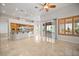 Expansive living space with kitchen island, sliding glass doors, and custom window shutters at 2742 Darby Falls Dr, Las Vegas, NV 89134