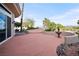 Backyard patio with desert landscaping, trees, and mountain views at 2742 Darby Falls Dr, Las Vegas, NV 89134