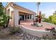 Home's back patio with rock landscape, desert plants, and view of the mountains at 2742 Darby Falls Dr, Las Vegas, NV 89134