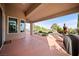 Covered outdoor patio with view of desert landscaping and mountains in the distance at 2742 Darby Falls Dr, Las Vegas, NV 89134