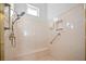 Shower area featuring a seat, shower head, and grab bar for safety at 2742 Darby Falls Dr, Las Vegas, NV 89134