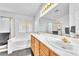Bright and spacious bathroom features dual sinks, a vanity, and lots of natural light at 2753 Trickling Brook Ct, Las Vegas, NV 89156