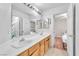 Bright bathroom features dual sinks, a vanity, and updated fixtures at 2753 Trickling Brook Ct, Las Vegas, NV 89156