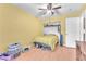 Comfortable bedroom featuring wood laminate floors, ceiling fan and closet at 2753 Trickling Brook Ct, Las Vegas, NV 89156