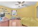 Inviting bedroom with natural light, ceiling fan and a wood laminate floor at 2753 Trickling Brook Ct, Las Vegas, NV 89156