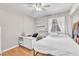 Comfortable bedroom features laminate flooring, neutral walls, and lots of natural light at 2753 Trickling Brook Ct, Las Vegas, NV 89156