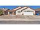 Charming single-story home with stucco siding, desert landscaping, and a two-car garage at 2753 Trickling Brook Ct, Las Vegas, NV 89156